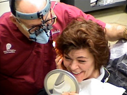 Patient feels elated when she sees her new teeth