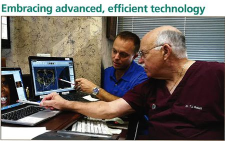 Embracing advanced, efficient technology -In photo, Dr. Thomas Balshi with Stephen Balshi examine digital plan