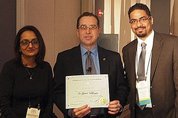 Photo taken at the AAFP February 2018: Drs Sangeetha Raghavendra and Avi Bidra, Prosthodontists from Connecticut pictured with Dr. Wolfinger