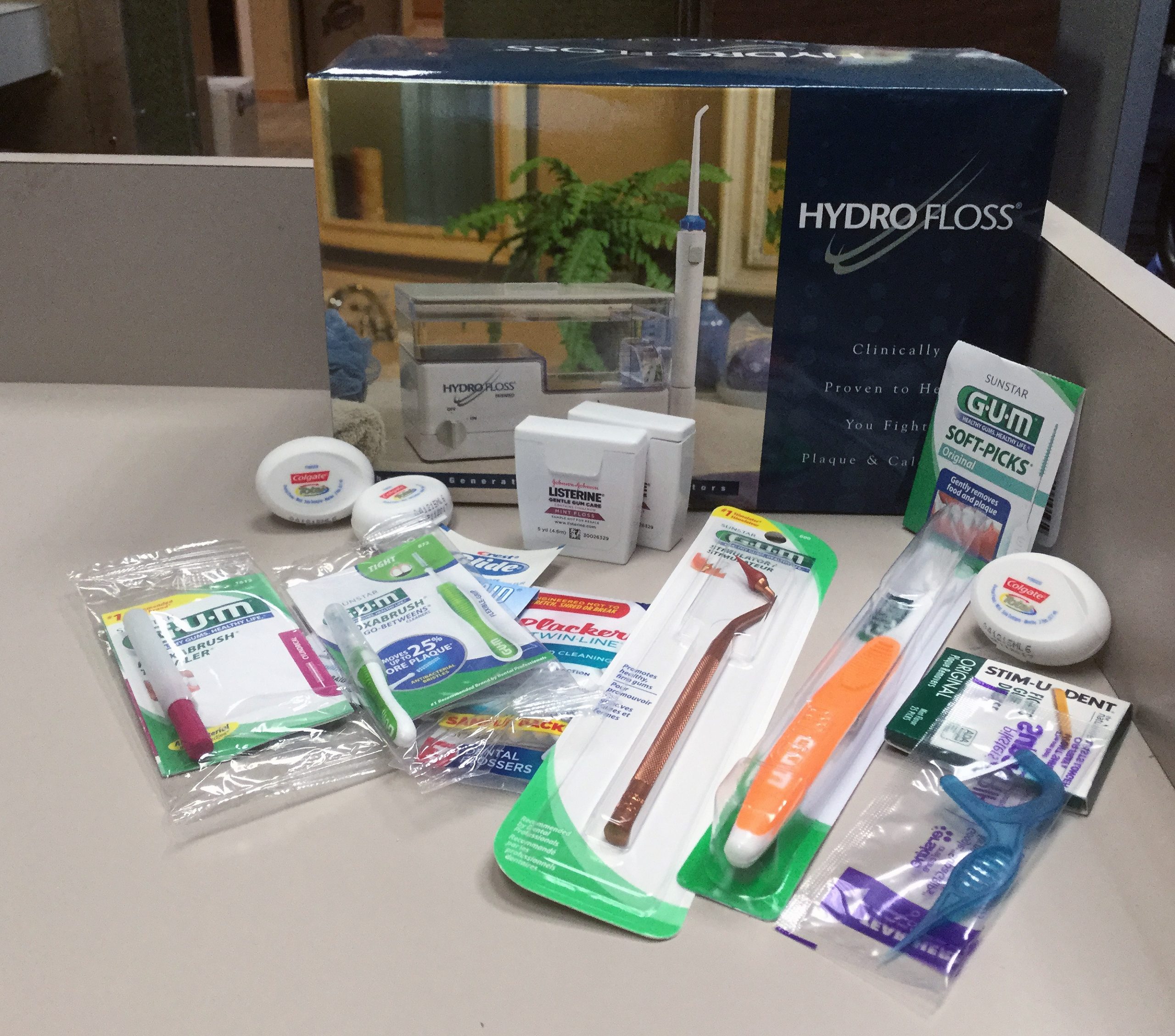 Daily oral hygiene home care can include dental floss, oral irrigators, proxabrushes