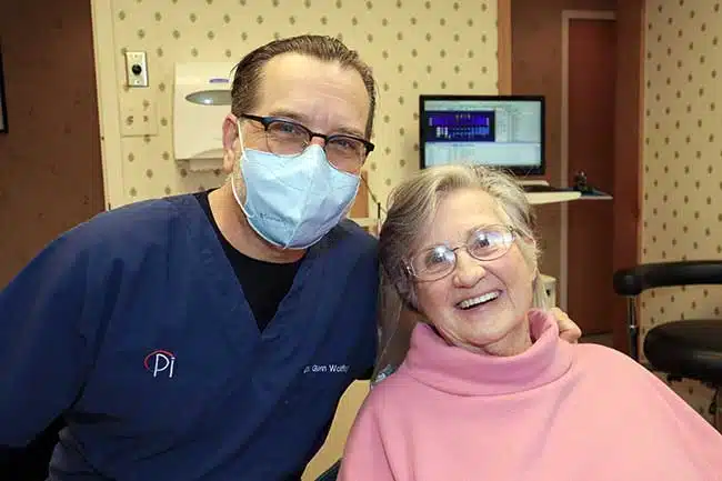 Dr. Glenn Wolfinger with patient who received Zirconia crowns
