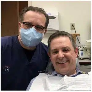 Post-treatment photo of a patient who received zirconia crowns with Dr. Glenn Wolfinger